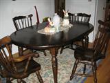 Excellant condition informal dining table with 6 chairs and 2 leaves.