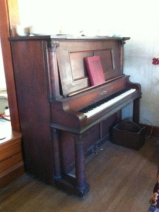 Player Piano that plays by hand also, we also have some piano rolls for sale.