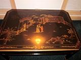 Oriental black lacquer coffee table from Plunketts.  Decorated with scenes, flowers, birds, etc.