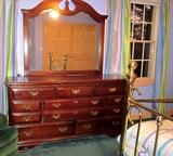 Triple dresser with 8 drawers by Manor House.  Brass hardware and Matching mirror.