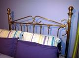 Queen size metal frame bed complete with mattress and box spring.