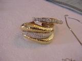 18K Bangle Bracelet with rows of diamonds in the center & a 14 k bangle bracelet holding 40 round diamonds 4.16 carats