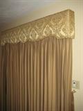 Many styles of custom drapes throughout the home.