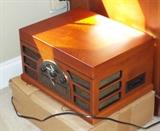 REPRODUCTION ON ANTIQUE RADIO AND HAS TURNTABLE, CD PLAYER AND RADIO