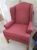 One of two burgandy chairs