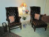 Klingman's custom tufted leather chairs with one ottoman