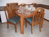 Oak dining table with 4 chairs and a leaf