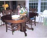 dark tone Mission-style oak dining room table & chairs