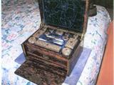 Ladies Victorian travel grooming set - silver covered glass cases, ivory handled tools with silver implements, etc. Velvet fitted interior and 2 drawers.