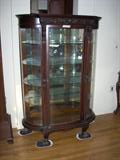 carved oak bow front display cabinet