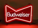 	Budweiser neon sign; Classic bow tie shaped logo neon sign. In working condition. Stamped on the back August 1989. It does not sit level and is made designed to hang from the chain. Measures 14 3/4H x 18 3/4W. 