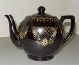 1940's Japanese tea pot; Appears to be hand painted on the sides and around the rim. Bottom is marked and stamped with Made in Occupied Japan. Measures 6 1/2H x 8L.