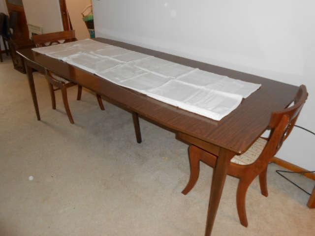 Vintage Dining Table with multi - leaves and in the drop leaf style.