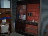 Large display cabinet from old Corner Drug Store store in Jourdanton, Sliding glass upper doors, solid sliding lower doors. This will a beautiful piece refinished.