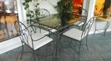 Patio Iron glass top table and 4 iron chairs