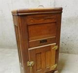 Small oak antique ice box with advertising plate