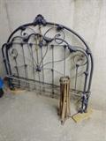 Ornate black double cast iron bed