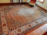 Nice large floor rug in orange and blue