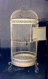 Enormous white iron bird cage with scroll legs