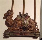Antique Judd camel book rack, expandable bookstand.