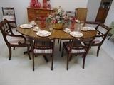 1850's English mahogany dining table with leaves and added pads