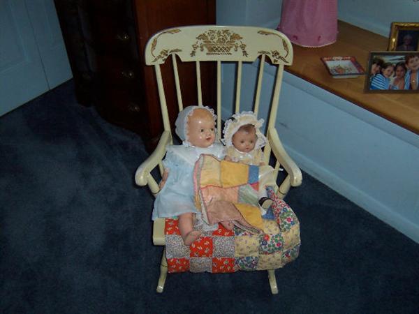 child's rocker with old dolls