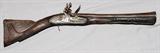 Lot#2, SMALL EUROPEAN BLUNDERBUSS, SILVER WIRE INLAYS, LATE 18TH EARLY 19TH C, L 12" BBL,21 1/4'' total length, flintlock, highly engraved stock with elaborate silver wire inlay all over stock and along top of 12'' barrel. No markings as to manufacture