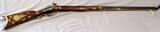 Lot#4, KENTUCKY, .38 CAL, PERCUSSION CAP RIFLE, C1840, L 40" BBL,Approximately .38 Cal., 40 1/2'' round barrel, percussion cap, double set trigger, wood ramrod, walnut half stock. Marked: "GEO. GOCECHER", C-1840's. Three football shaped brass inlays in right side of stock in front of hammer, eight inlays (stars, diamonds, crescent moons) surround the round pattern brass patch box. Nine inlays (hearts, arrowheads, stars, moons, football shaped) on the left side of stock, very ornate.