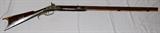 Lot#12, KENTUCKY, PERCUSSION CAP RIFLE, .36 CAL., L 36" BBL.Approximately .38 Cal., 36 1/2'' octagonal barrel, percussion cap, double set trigger, brass hardware, no inlays, plain wood ramrod. Marked: "W. H. BRUMFIELD" (Brumfield was a gunsmith in Perrysville, Indiana from 1846-1875).