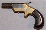 Lot#28, J. M. MARLIN, 'VICTOR MODEL' DERRINGER, .38 CAL, C1870-80, L 2 3/4" BBL,Single shot .38 Cal. Rimfire, brass framed with rosewood grips. Marked: "J.M. MARLIN / NEW HAVEN, CT. / PAT. APRIL 5, 1870" on side of barrel and "VICTOR" on top of 2 3/4'' barrel. C-1870-1880.