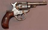 Lot#42, COLT MODEL 1877 'LIGHTNING", DOUBLE ACTION REVOLVER, L 3 3/8" BBL,.38 Cal., Marked: "COLTS PTD ARMS CO / HARTFORD, CT. USA" on 3 3/8'' barrel and "PAT. SEPT. 19, 1871, SEP. 5, 1874, JAN. 19, 1878" on frame. Serial no. 103725. Nickel finish with wood grips. C-1900.