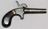 Lot#45, SINGLE SHOT PERCUSSION PISTOL, C1850'S, L 2" BBL,Approximately .28 Cal., 2'' tapered, screw-off barrel, spur trigger and bulb shaped wood grips. No markings present on pistol. C-1850's.