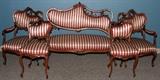 Lot#90, VICTORIAN, LOUIS XV, MAHOGANY PARLOR SET, 19TH C., 5 PCS., H 51' SETTEE,includes a hand carved mahogany settee with an asymmetrical acanthus leaf carved back frame striped upholstery, contoured legs, 51" L., two armchairs, carved mahogany asymmetrical frames, contoured legs, also with striped upholstery; two side chairs also asymmetrical mahogany frames, striped upholstery;
