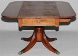 Lot#91, DUNCAN PHYFE STYLE, MAHOGANY, DROP LEAF TABLE, H 27" W 24", (44" LEAVES OPEN), D 24"having two drop leaves with a drawer on the side with brass pull. Pedestal base with curved legs and brass paw feet. Each leaf is 10" W. When opened 44" W. when folded down table is 24" W.