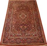 Lot#109, ANTIQUE PERSIAN, KASHAN RUG, HAND WOVEN WOOL, C. 1920-30, H 6'10" X W 4'4"having a red ground, five borders, central diamond shape floral medallion with two smaller medallions. Floral designs throughout.