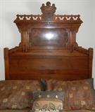 Lot#184, ANTIQUE AMERICAN WALNUT BED C. 1890,Headboard, 84" H. x 55" W. footboard, 30" H. x 55" W and side rails. Burl wood, leaf, scrolling & circular design,
