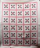 Lot#312, HAND MADE APPLIQUE QUILT CIRCA 1900 TO 1930 W 84" L 72"Hand made quilt with applied rose design circa 1900 to 1930.