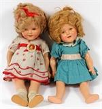 Lot#396, SHIRLEY TEMPLE DOLLS 1935 H 17" ONE BY IDEAL,hard plastic. One with badge and white dress with polka dots. Other with blue dress [no shoes]. Both with open shut eyes, open mouth with teeth. Both impressed "Shirley Temple on head and body.