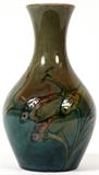 Lot#1006, MOORCROFT POTTERY VASE WITH FISH MOTIF, C. 1930, H 8"Decorated with swimming fish on a ground shaded olive green to blue; impressed "Moorcroft, Made in England" with signature in blue under glaze (see additional photo).