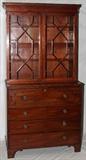 Lot#1012, AMERICAN CHIPPENDALE STYLE MAHOGANY SECRETARY BOOKCASE, H 87", W 42 1/2", D 20"Having a slant drop front revealing five pigeonholes with four drawers on either side, all above three full-width lower drawers. Brass pulls. Raised on bracket feet.