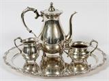 Lot#1079, K. UYEDA, JAPANESE STERLING COFFEE SET WITH TRAY, FOUR PIECES..A K. Uyeda sterling silver set includes 1 coffee pot, 1 creamer, 1 sugar bowl, and 1 tray; each stamped "Sterling, 950, K. Uyeda". Total weight is approximately 67.86 tr.oz. The grouping also includes an electroplated Heirloom Colonial Suite tea pot.