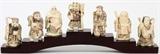 Lot#1151, CHINESE CARVED IVORY FIGURES (7), 'SEVEN LUCKY GODS', H 2 1/2"Set of 7. All having polychrome decoration and etched detailing, raised on a stepped stand.