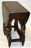 Lot#1228, OAK GATE-LEG TABLE, W 14", L 34"Oak gate leg table. Opens to oval shape, 47".