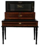 Lot#2065, PAILLARD SWISS MUSIC BOX + 4 CYLINDERS, C 1900 L 31"Circa 1900. Floor style. Four cylinder rolls @ 10". Lovely rosewood and inlaid fruitwood case having drawer at base with extra three cylinders. Missing teeth on comb. Case size: L 31" H 14". Raised on four turned legs.