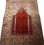 Lot#2072, ANTIQUE GHIORDES SILK PRAYER RUG, 43" X 62"Red ground flanked by columns. Ex. Collection: Clarence Monroe Burton [American November 18, 1853-October 23, 1932] of Burton Abstract Company.