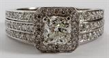 Lot#2085, 14 KT WHITE GOLD, 1.02CT CUSHION CUT DIAMOND GIA RING,14kt white gold diamond ring. Having a 1.02 carat cushion cut center, with side diamonds weighing 1.20 carats in total. The center diamond has a K-color, SI-1 clarity rating, and the side diamonds have a G-color, VS-2 clarity rating. The total weight of the ring is 5.5gms. GIA report included.