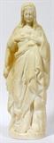 Lot#2149, ITALIAN MARBLE FIGURES, SACRED HEART OF JESUS AND SACRED HEART OF MARY, TWO, H 15.5"Italian carved marble figures of The Sacred Heart of Jesus and The Sacred Heart of Mary, 20th century. Modeled as the standing figures of Christ and Mary, Christ with one hand raised in blessing, the other held over the flaming heart at his breast while Mary's hands rest on her chest.