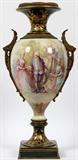Lot#2257, A. LEFRANC SIGNED SEVRES HAND PAINTED PORCELAIN & BRONZE TALL VASE, H 27" TOTAL, W 13".Hand painted courting scene on recto with verso having a landscape; green with raised fired gold; bronze ormolu; leaf and floral side handles; no bottom mark; no cover.