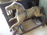This is a fantastic old child's horse.. unfortunately, he has sustained a leg injury over the years.  He is still an amazing piece of the past!