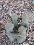 Sculpture of four children in a circle
